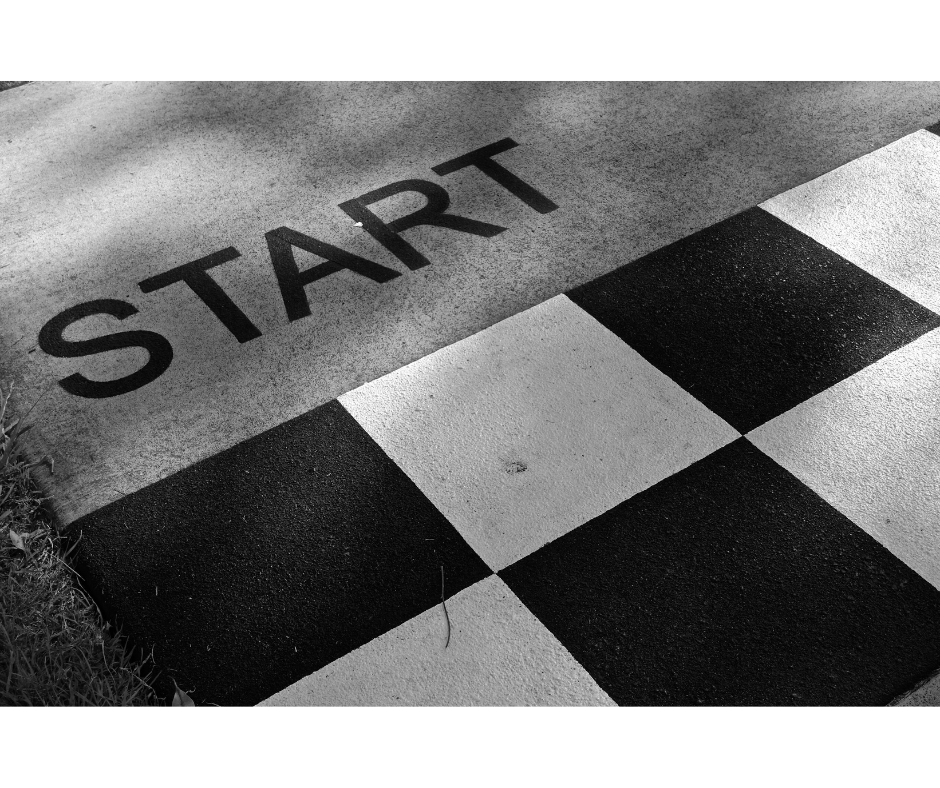 Black and white start line on pavement symbolizing new beginnings and readiness to take the first step